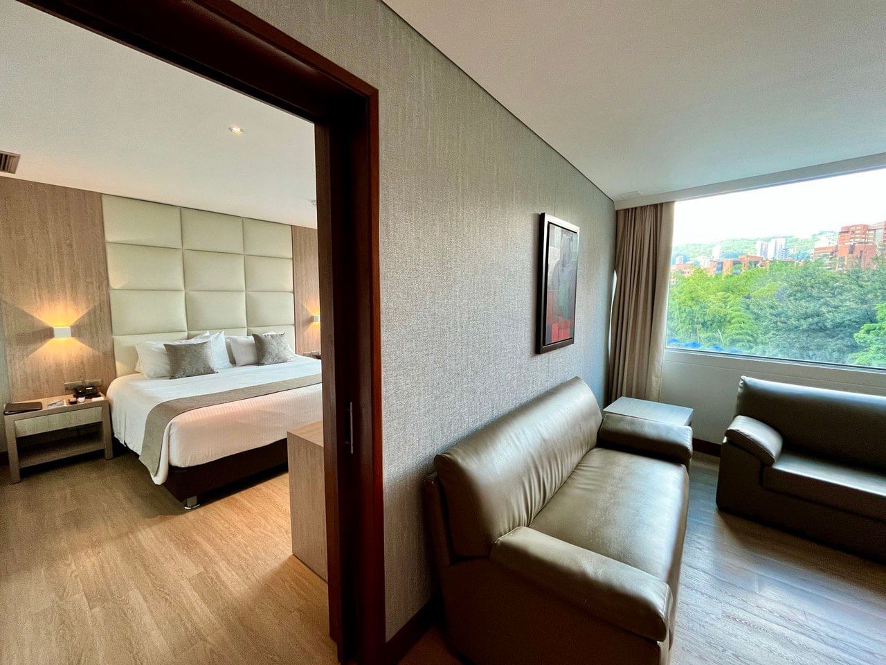 Living area with bedroom in a Suite at San Fernando Plaza Hotel