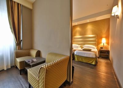 Bedroom & living room in Junior Suite at Hotel Mozart Milan