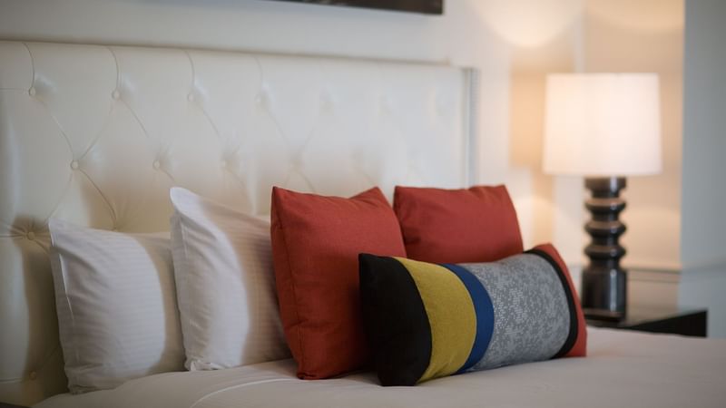 Cushion on a bed in Modern Art Suite at Warwick New York