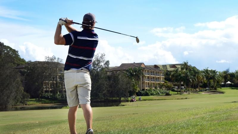 Man playing golf at Mercure Gold Coast Resort