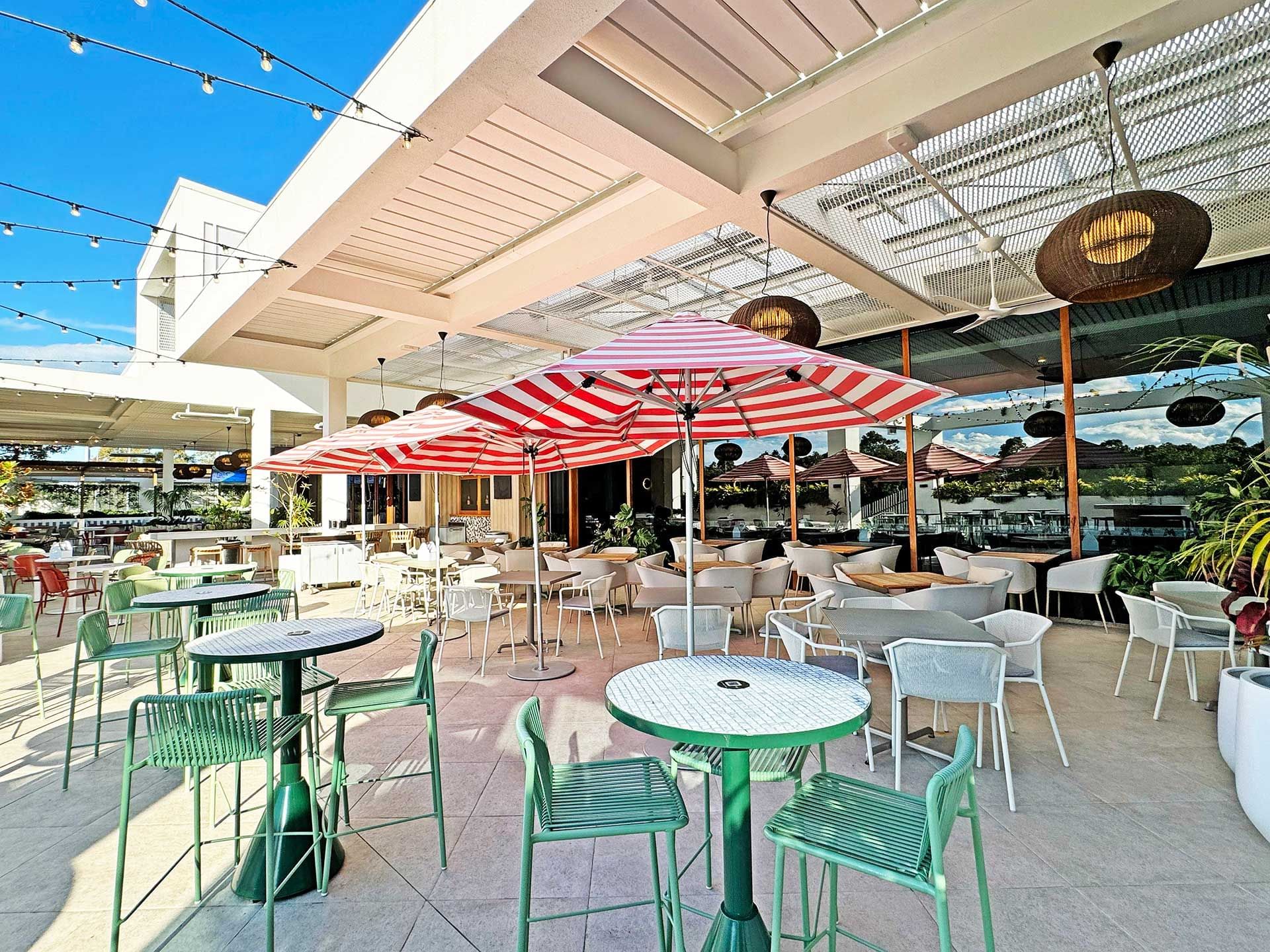 The outdoor dinning area of the Hadley’s restaurant with  tables and chairs at Encore by Mingara