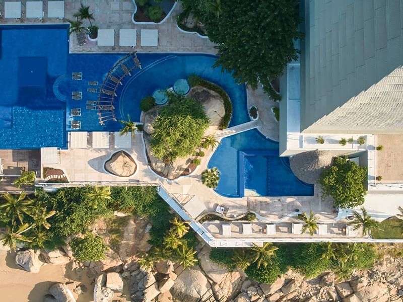 Top view of sunbeds by the outdoor pool at FA Hotels & Resorts