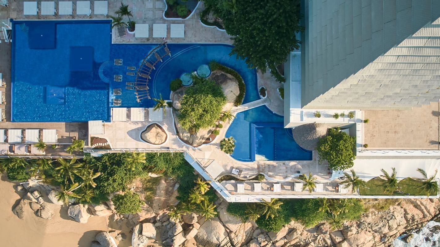 Top view of sunbeds by the outdoor pool at FA Hotels & Resorts
