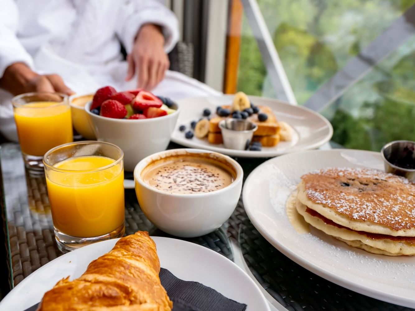Juice, pancakes, croissant & coffee served at Nita Lake Lodge