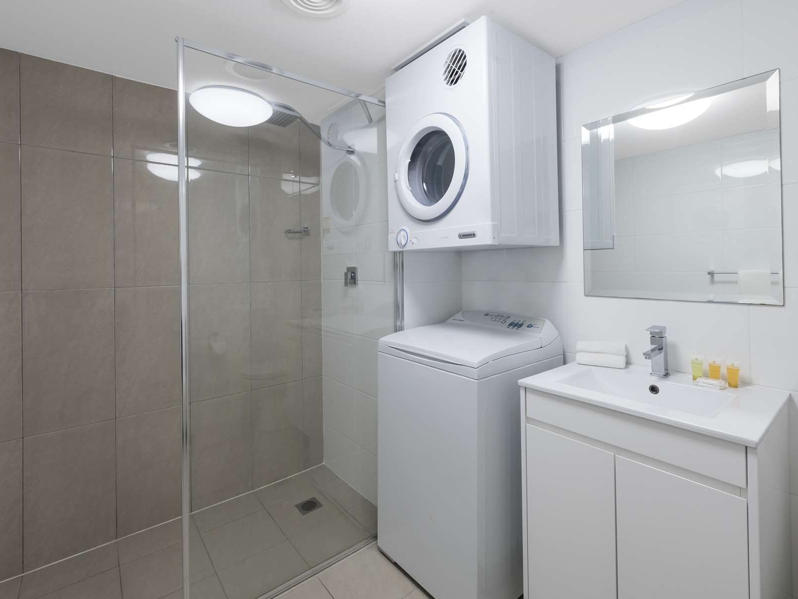 Washing machine & dryer in Laundry at Nesuto The Entrance Apartments