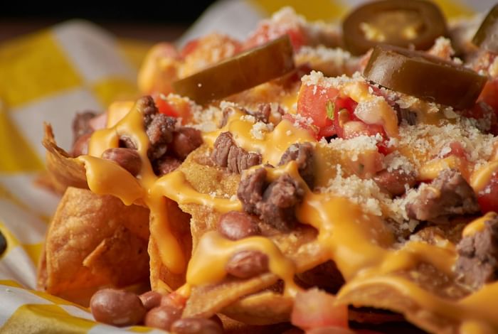 Beef nachos with cheese served at Anaheim Portofino Inn, budget-friendly suites near Disneyland for large families