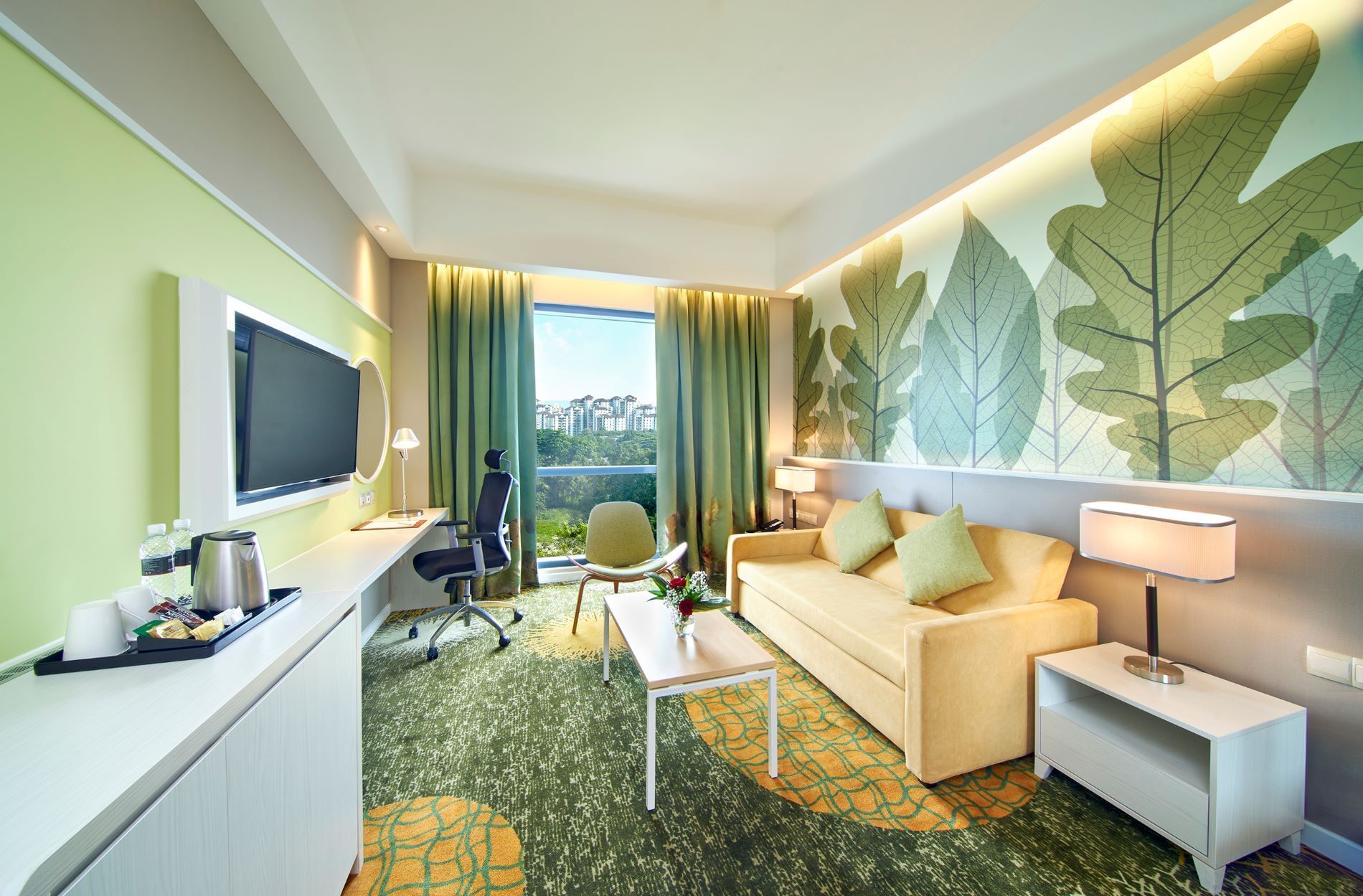 Living area with sofa and TV in Junior Suite at Sunway Velocity Hotel