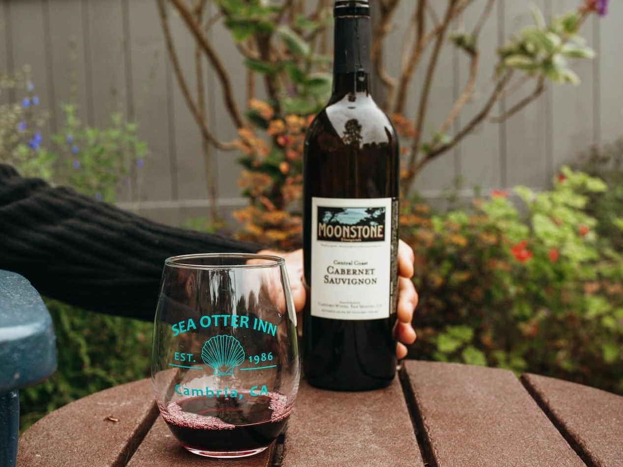 Enjoy a bottle of house wine and pair of signature, monogrammed stemless wine glasses