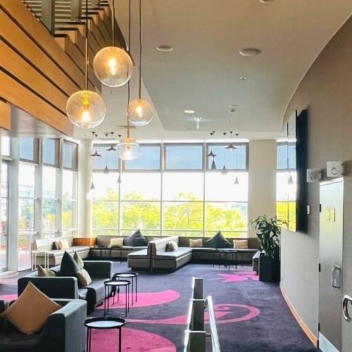 Lobby area with outdoor view at Novotel Sydney Olympic Park