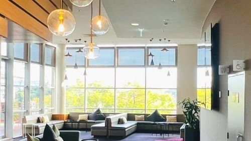 Lobby area with outdoor view at Novotel Sydney Olympic Park