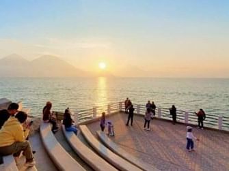 People enjoying the sunset in San Antonio Palopo near Regis Hotel & Spa