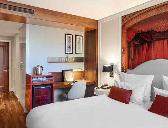 Workspace and Espresso machine by the bed in the Classic Room at Titanic Gendarmenmarkt Berlin.