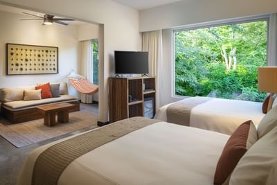 Resort Suite 2 Queen Beds with TV, sofa and a greeny outside view at El Mangroove Hotel