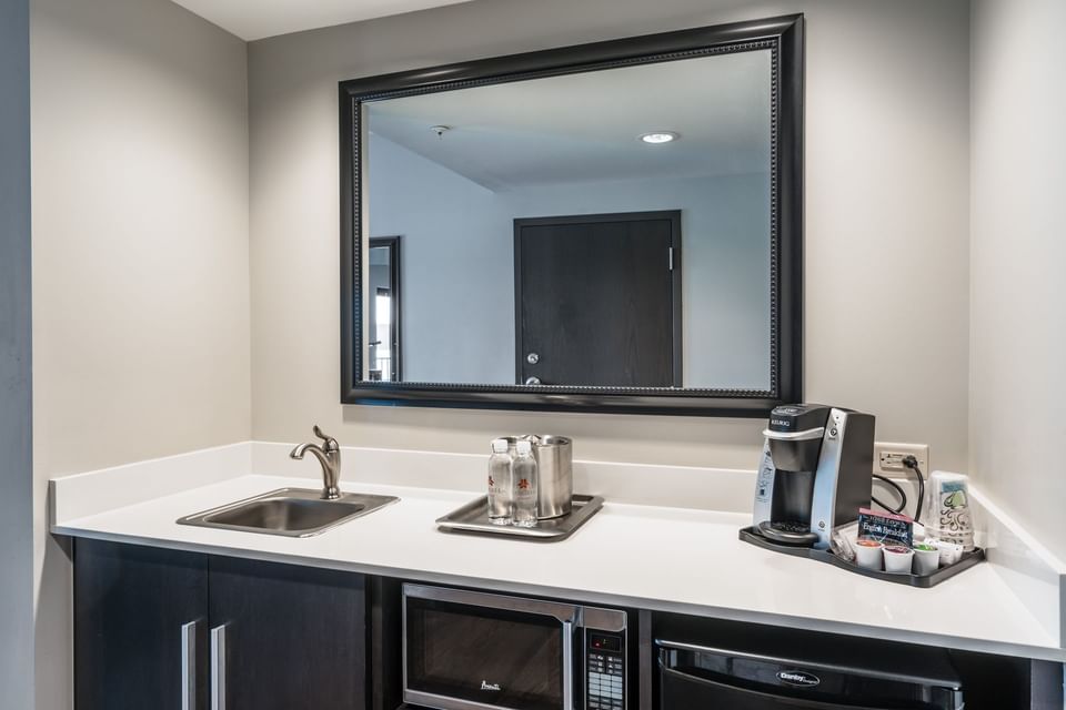 Kitchenette with a mini fridge & coffee maker in Double Queen Suite Balcony at Shangri-La Monkey Island