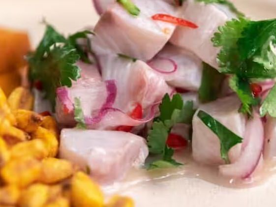 Fresh ceviche with cilantro, onions, and chili with side of corn at Flores in Ananea Madivaru Maldives
