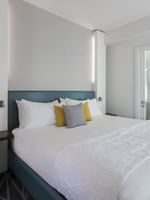 Bed by vanity area in Penthouse René-Lévesque at Warwick Le Crystal Montreal