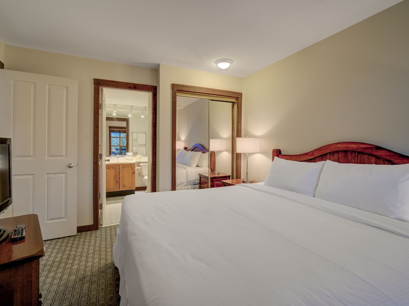 bed with white sheets in hotel room
