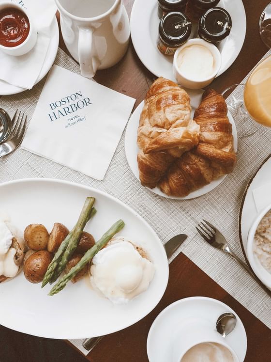Pastries, jams, coffee, creamer, breakfast dish