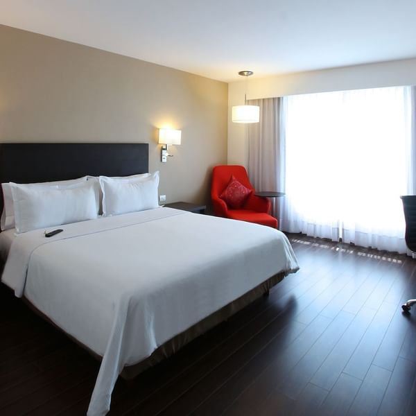 Interior of Superior Room with furniture at Fiesta Inn