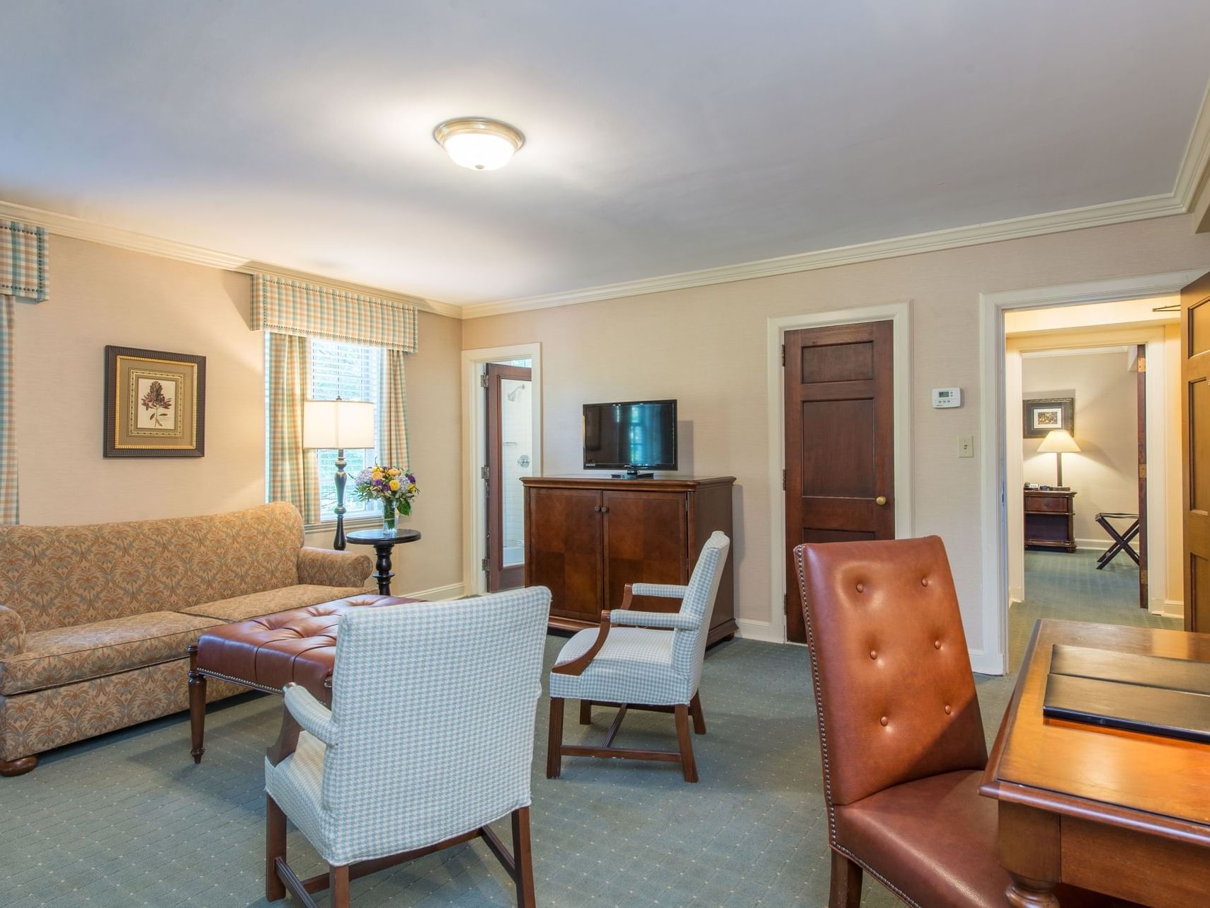 Lounges in the living area of Fireplace Suite at The Exeter Inn