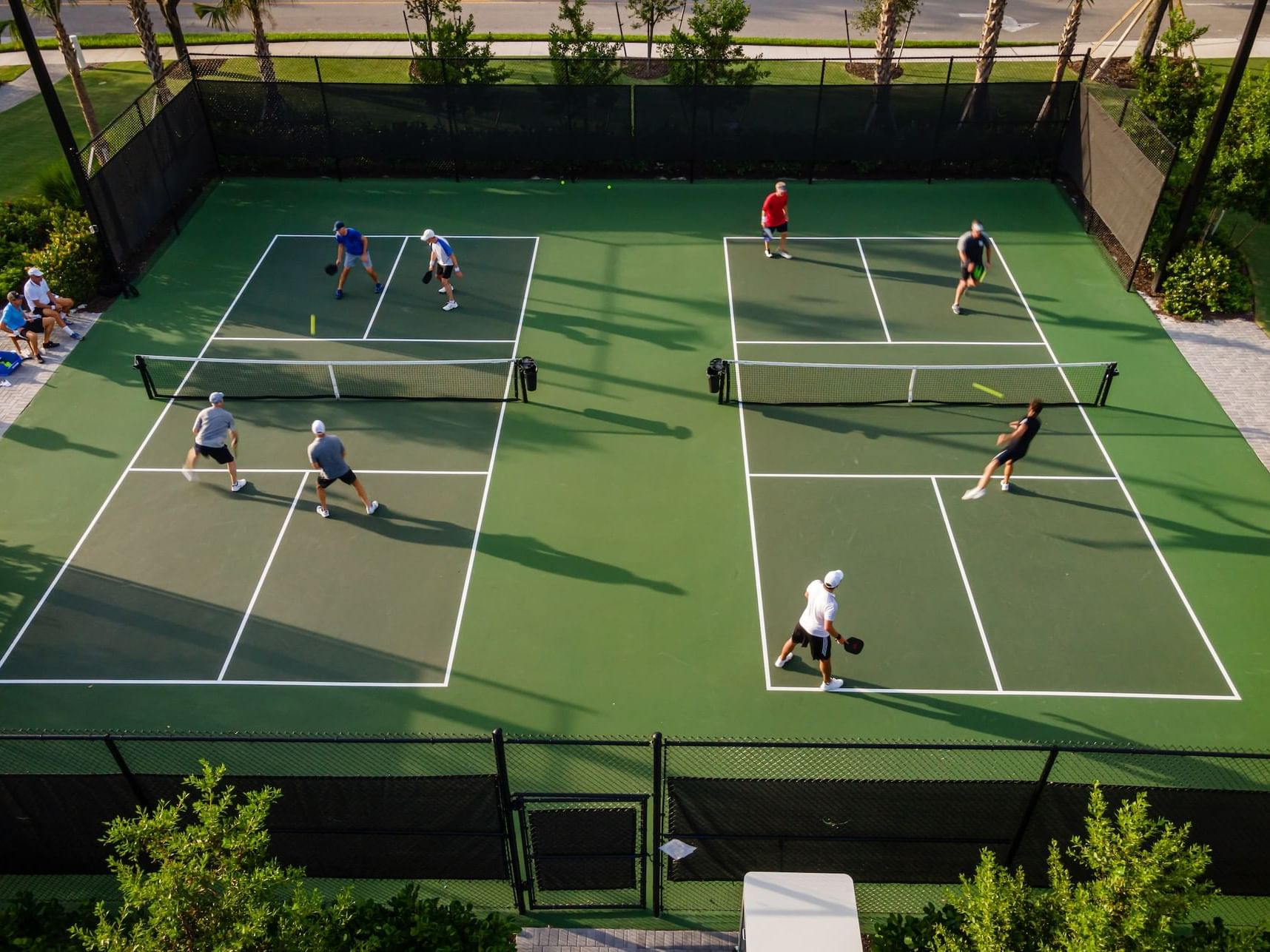 Aerial view of pickleball courts & players at Innovation Hotel