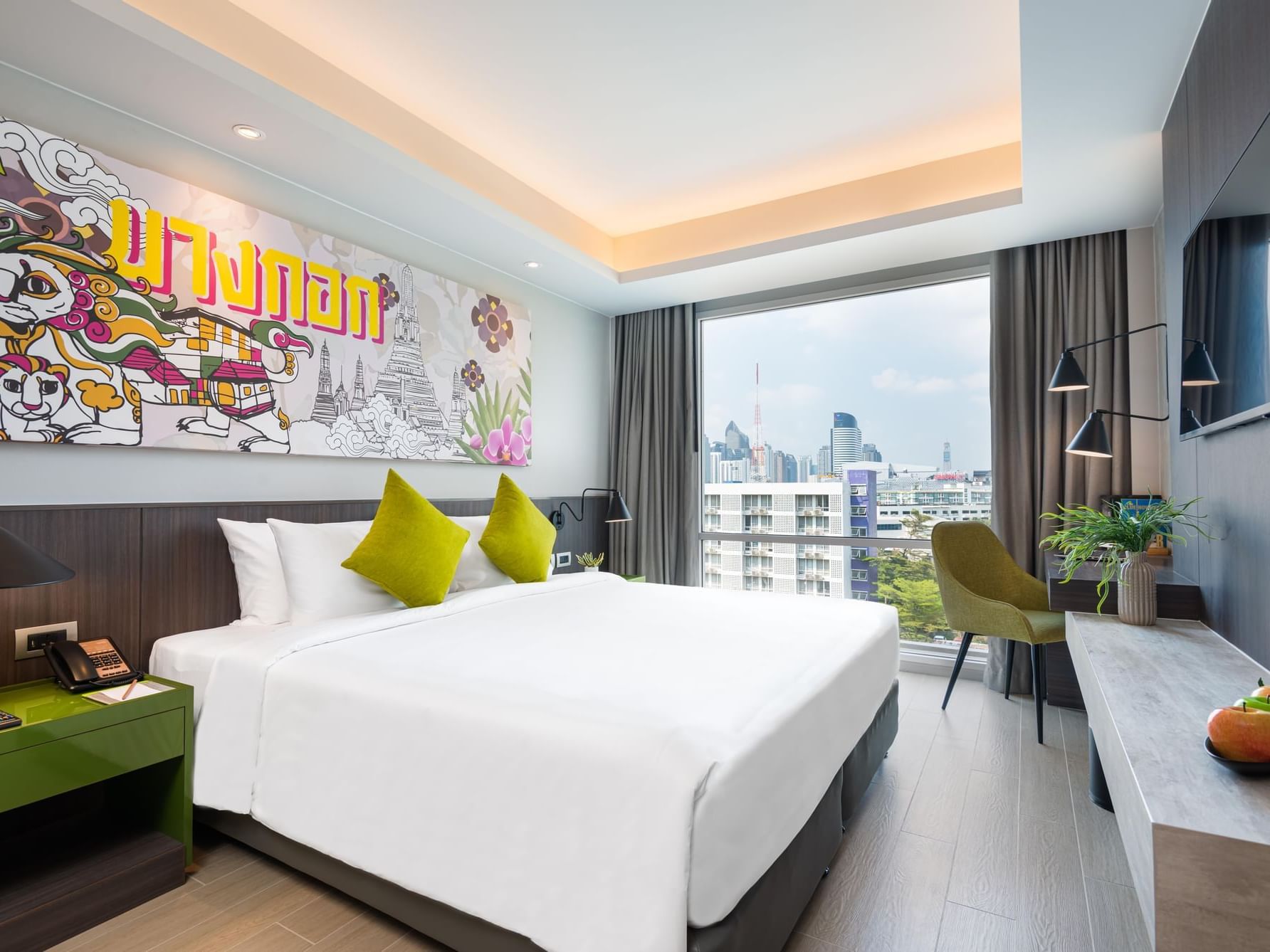 King bed in the Deluxe Room at Maitria Hotel Rama 9 Bangkok