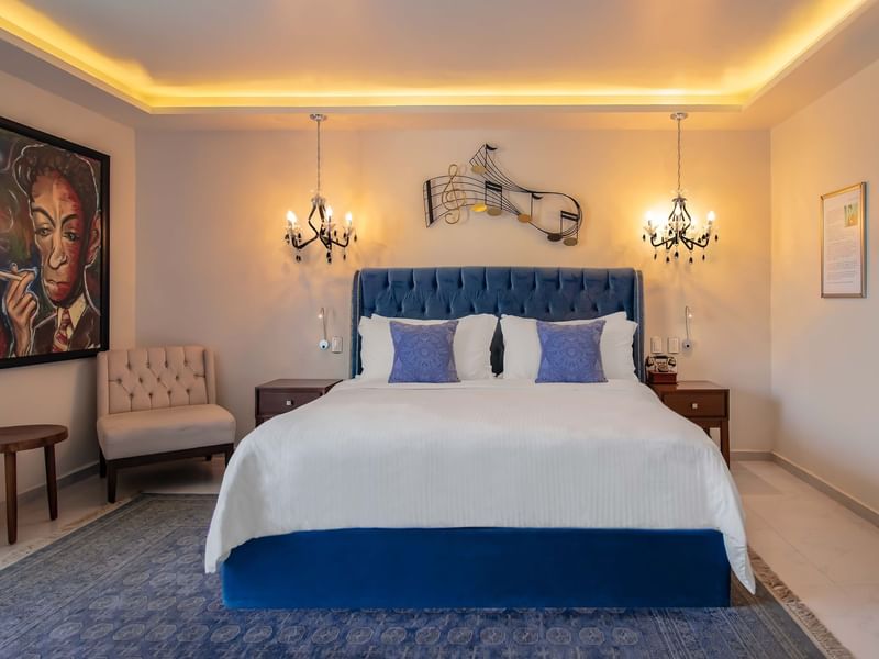 King bed & lounge in Deluxe room at Curamoria Collection