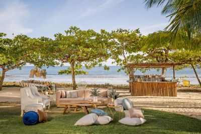 A dining & lounge area with a beach view at Punta Islita Hotel