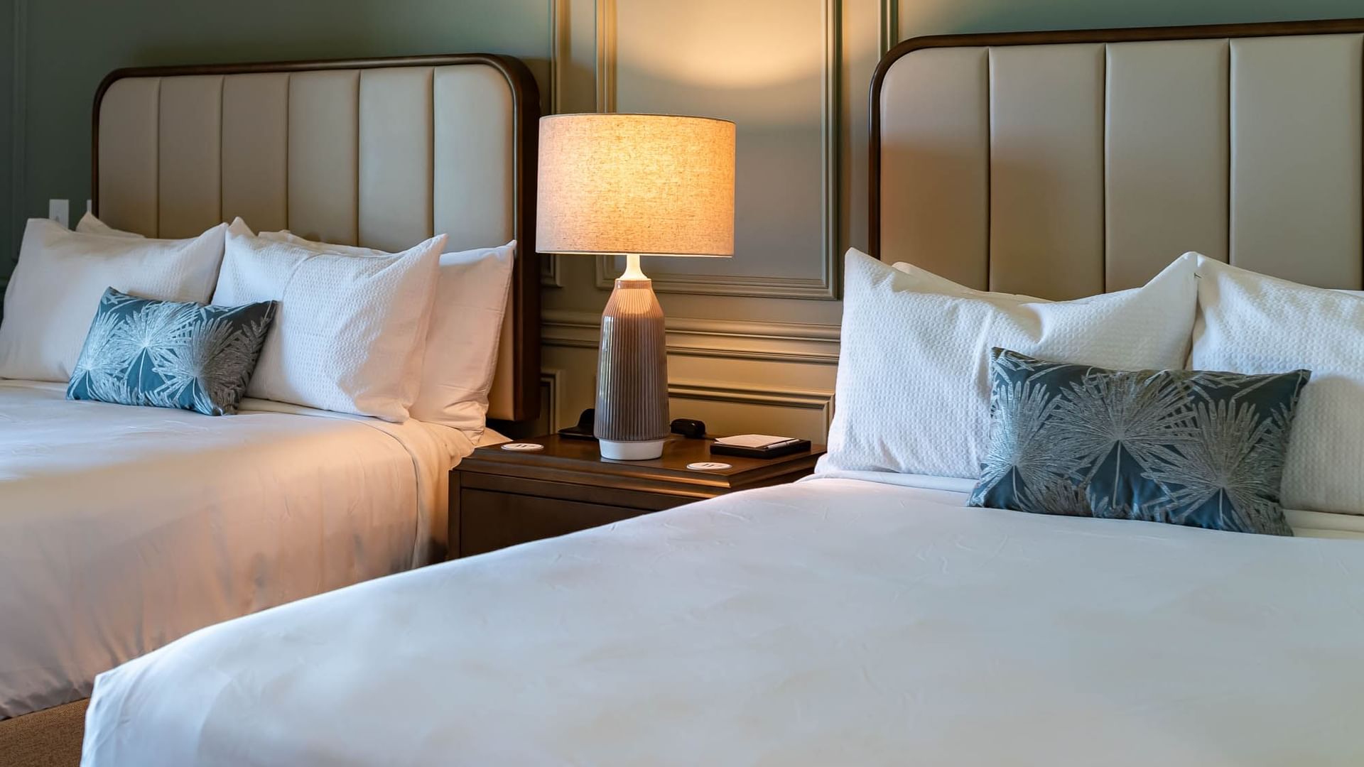 Lamp by the comfy twin beds in Queen Room at Camp Creek Inn