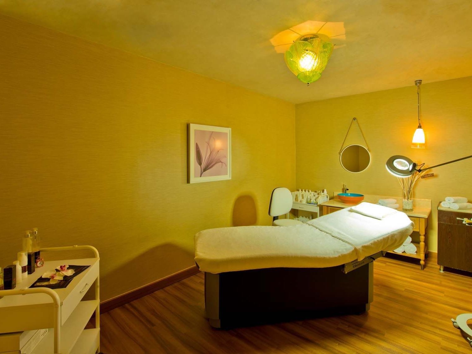 Massage bed around with treatment stuffs in BeFine Spa at Titanic Deluxe Lara