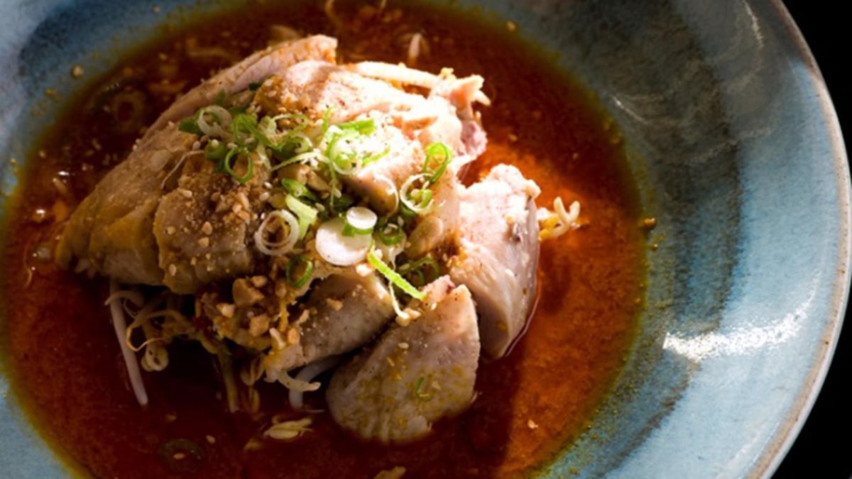 Chicken topped with green onions served in Spice Temple Restaurant at Crown Hotel Melbourne