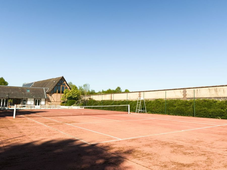 Tennis court in Chateau du Landel at The Originals Hotel
