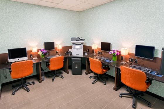 business center with chairs and computers