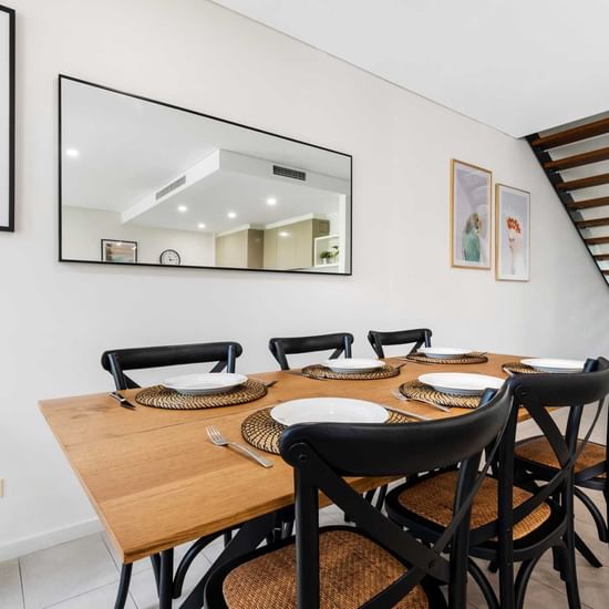 Dining table arranged in Deluxe Three Bedroom at Pullman Magenta Shores Resort