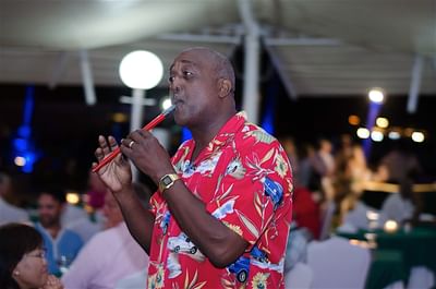 Man playing the flute to entertain the guests at Accra Beach Hotel & Spa