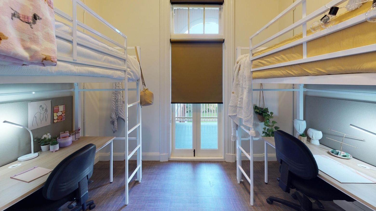 Twin Loft room with two bunk beds and desks underneath at UniLodge Herston.