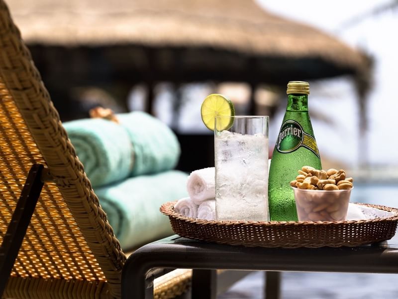 Perrier bottle, cashew & towels given at Grand Fiesta Americana