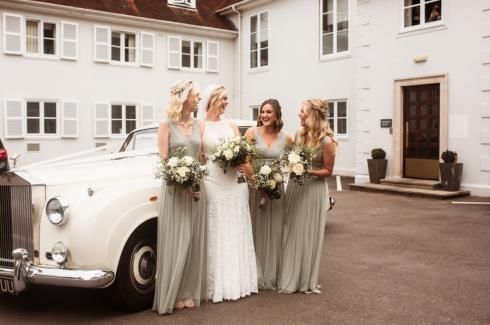 bridesmaids and bride outside of gorse hill in surrey