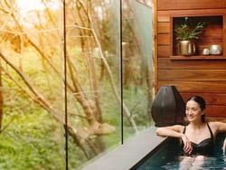 Lady relaxing in Hepburn Springs spa at Brady Hotels Jones Lane