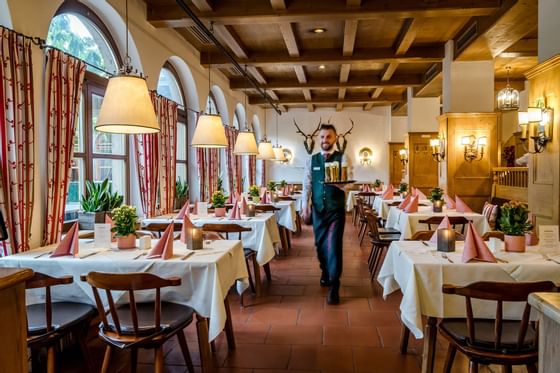 Waiter serving an order at Braurestaurant Imlauer