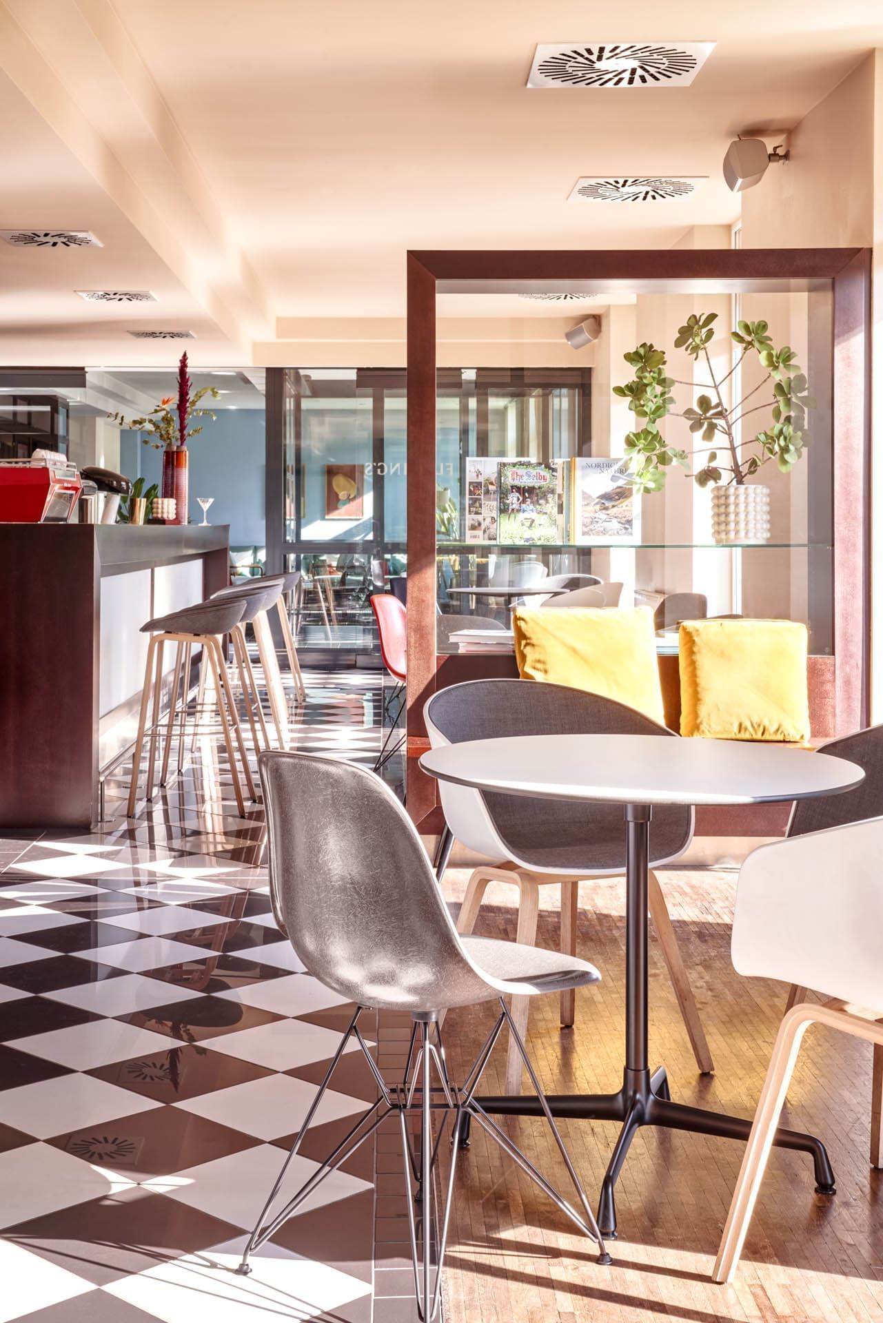 Seating arrangements in a restaurant & a bar at Flemings Hotels