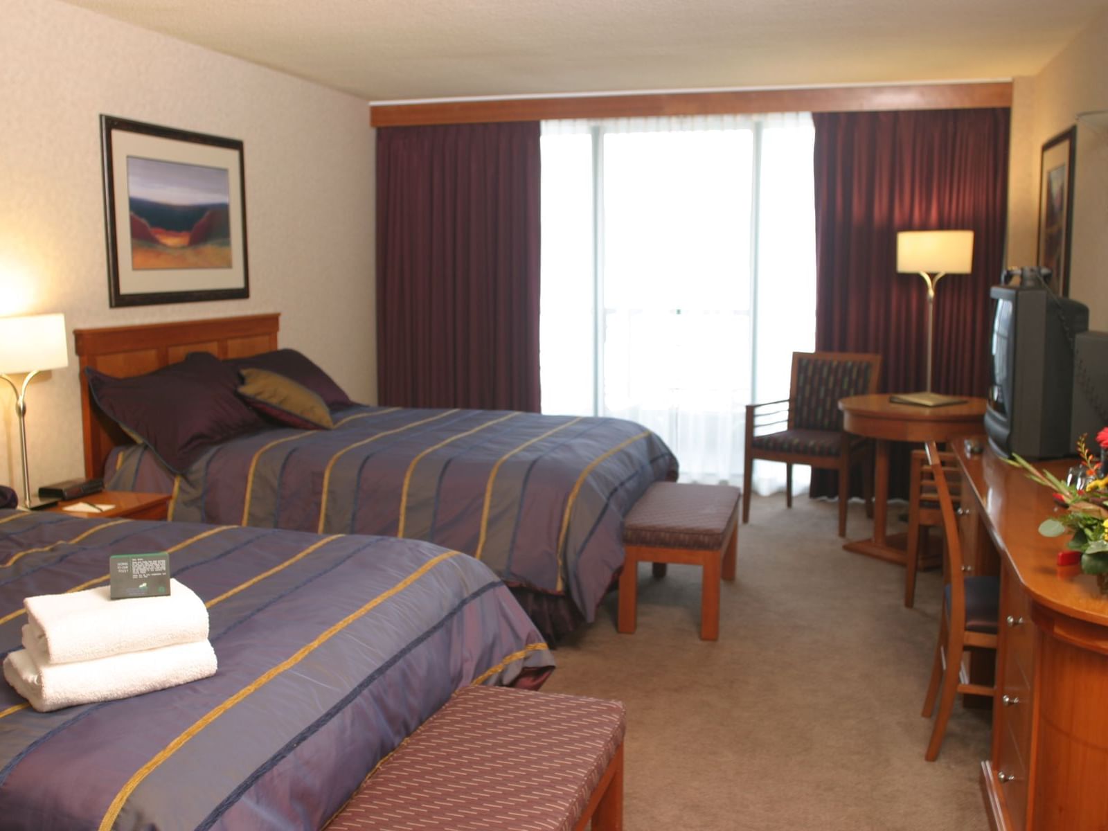 two beds in carpeted hotel room