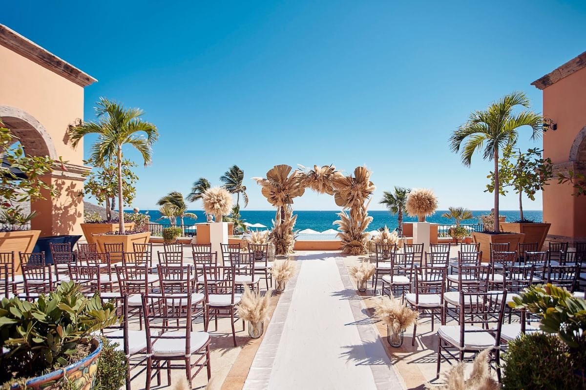 Outdoor wedding setup facing the sea