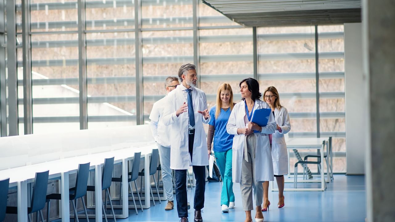 medical professionals walking in a hospital hallway