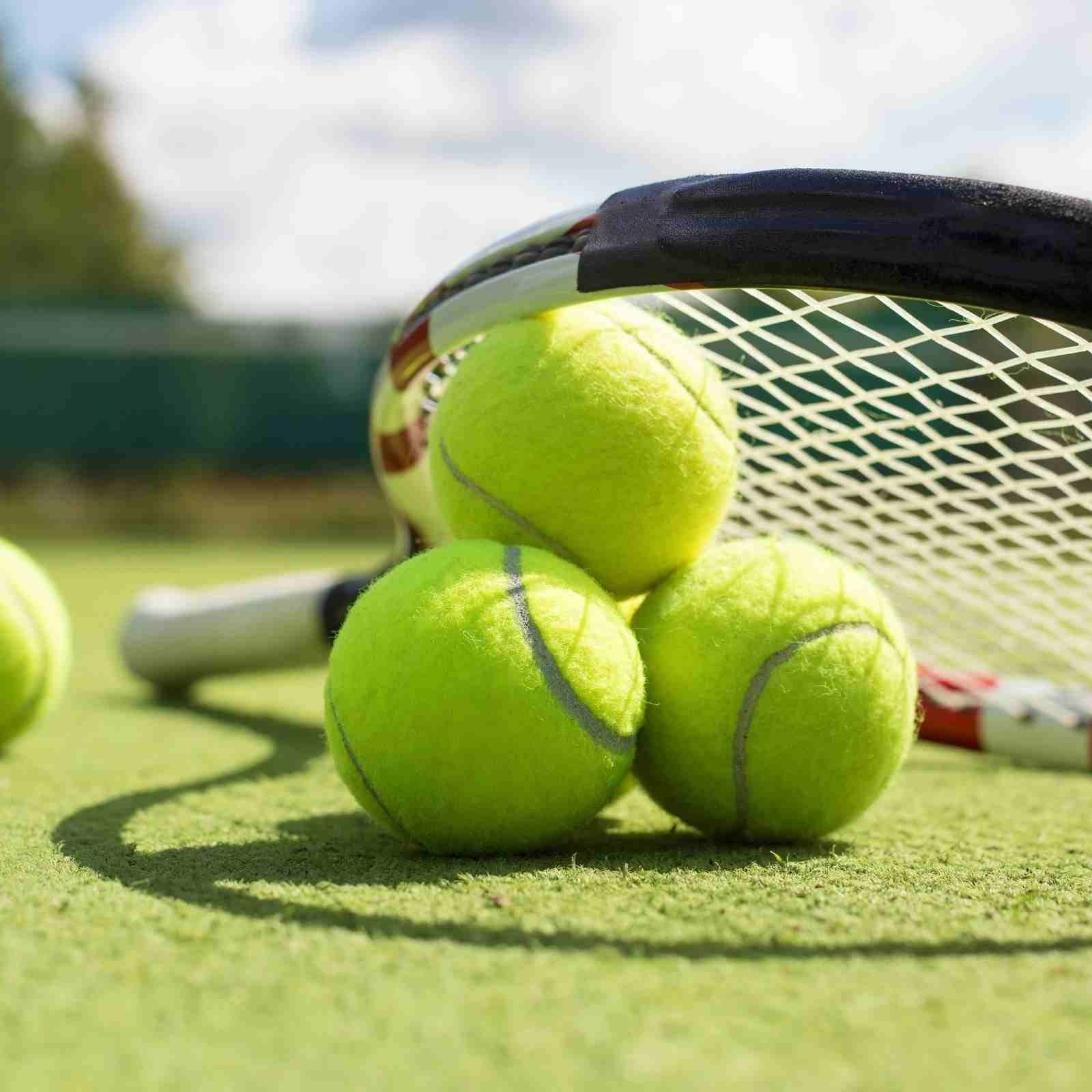 Close-up of tennis balls with racket at Sloane Square Hotel