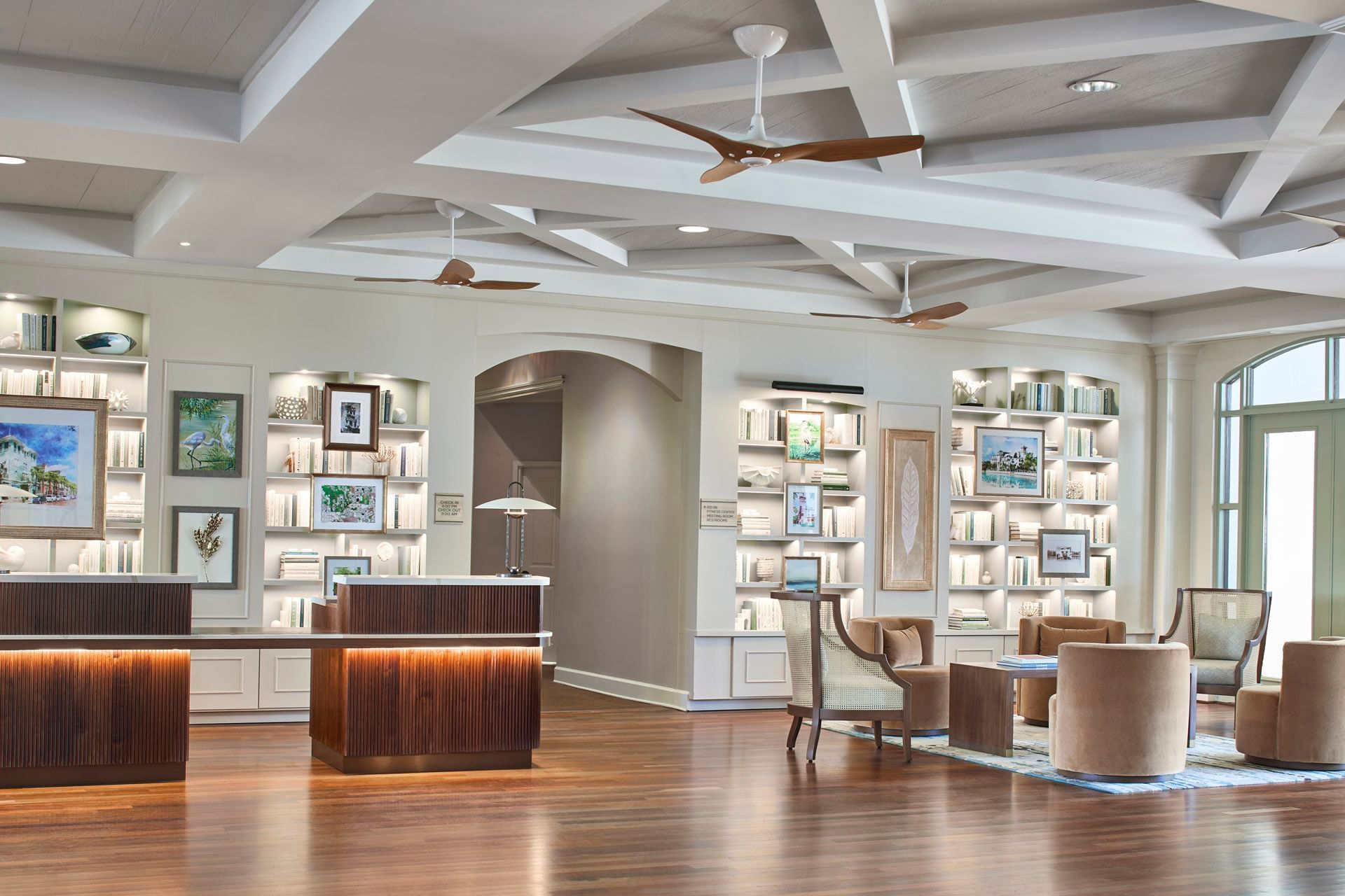 The stylish Inn at Celebration lobby features welcoming decor and beautiful pictures of celebration Florida for guests