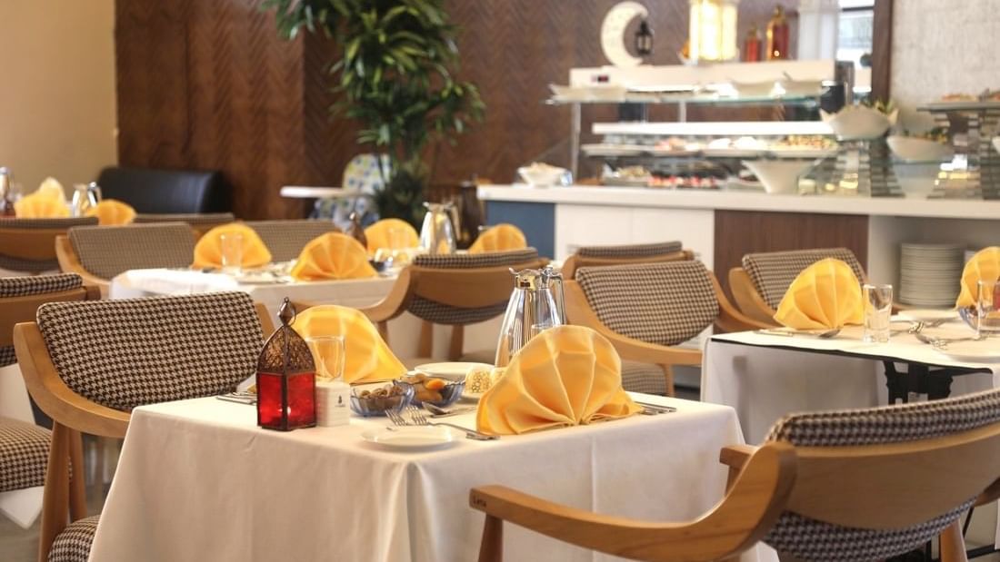 Dining table arrangements in Seasons Restaurant at Warwick Hotel Jeddah