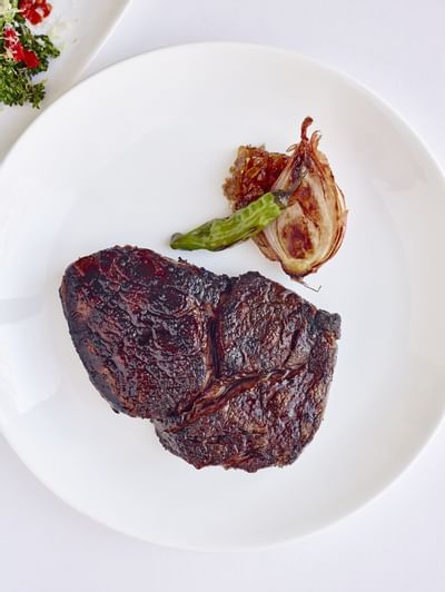 Close-up of a steak dish served in Rugby Grille, Townsend Hotel