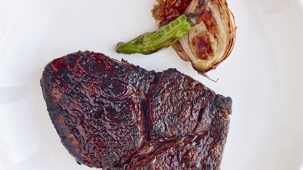 Close-up of a steak dish served in Rugby Grille, Townsend Hotel