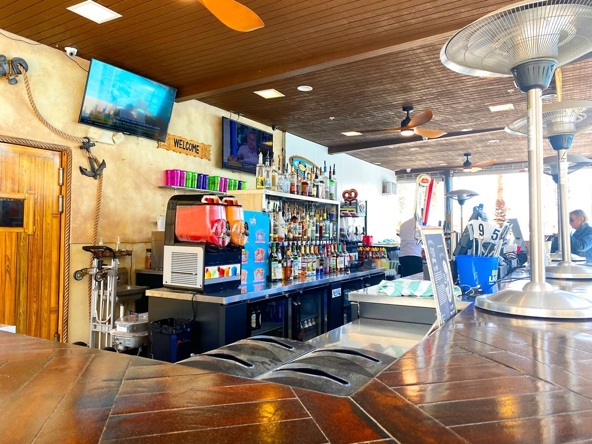 Bar counter with shelves in LBV Village Bar & Grill at Lake Buena Vista Resort Village & Spa